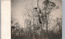 MAN CLIMBING TREE c1910 real photo postcard rppc silly unusual scene picture