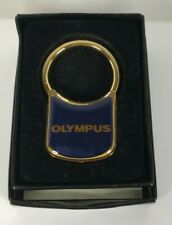 Vintage Olympus Navy and Gold Tone Brass Keychain in Original Box  picture