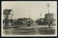 WA Long Beach RPPC 20s PACIFIC AVENUE STREET SCENE Cars STORES Wesley Andrews 51 picture