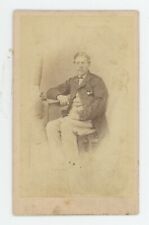 Antique CDV Circa 1870s Handsome Man Sitting in Chair Posing in Fancy Suit & Tie picture