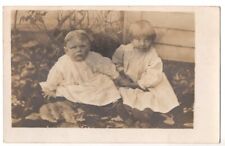 VINTAGE RPPC TWO ADORABLE BABIES SEATED ON GROUND REAL PHOTO POSTCARD 101320 P picture