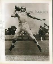 1953 Press Photo Paul Cameron, UCLA tailback, stretches with a few passes picture