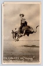 RPPC Cheyenne WY Rodeo Bull Rider Action Red Sublett on Topsy Doubleday Postcard picture
