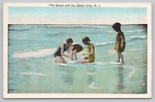 Postcard The Ocean and Us, Ocean City New Jersey, kids in the water picture