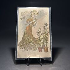 Embossed Easter Greeting Woman Holding Flowers Vintage Postcard picture