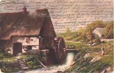 Woman Standing Near An Old Watermill With Small House Behind Postcard picture