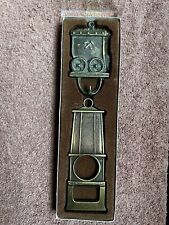 Hanging Brass Bottle Opener, Vintage Antique Collectible, Crossed Hammer Emblem picture