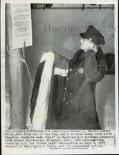 1956 Press Photo Patrolman Arthur J. Harris lowers the Union Jack in Watertown picture