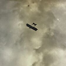 Vintage Sepia Photo Double Wing Airplane Biplane Flying Through Sky Air Clouds picture