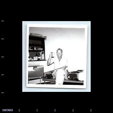 Vintage Square Photo MAN SITTING ON BED HOLDING CAN picture