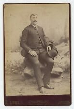 Antique c1880s Cabinet Card Handsome Man Sitting On Rocks With Hat Lewiston, ME picture