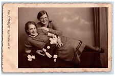 Girls Postcard RPPC Photo With Scary Jester Clown Toy c1905 Unposted Antique picture