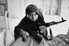 Photo of 106-year-old Armenian woman protecting her home with AK 47 (1990) picture