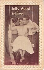 1911 Comic Romance Sepia PC of Two Men Kissing Lady in Swing-Jolly Good Fellows picture