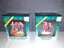 2 Christmas Figurines Baby Boy Fireplace + Kids on Sled Timeless Treasures picture