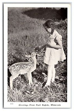 PARK RAPIDS Minnesota ~  Girl feeding deer ~ Hunting fishing picture