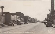 Postcard RPPC Colorado CO Alamosa Business Dist. Newspaper Movie Show Old Cars picture