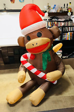 Gemmy Sock Monkey Airblown Christmas 5’ Lighted Inflatable Santa Hat Candy Cane picture