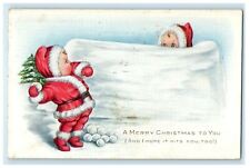 1918 Christmas Children In Santa Claus Playing Snowballs Embossed Postcard picture