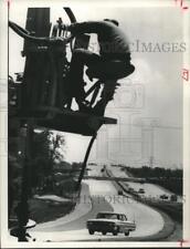1964 Press Photo Man sits on construction equipment at La Porte, TX freeway picture