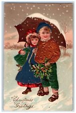 c1910's Christmas Greetings Boy Girl Umbrella Holly Snowfall Embossed Postcard picture