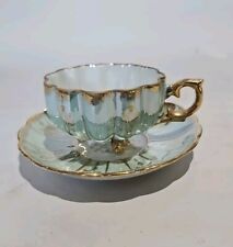 1950s ROYAL SEALY JAPAN GREEN GOLD IRIDESCENT SCALLOPED 3 FOOTED TEACUP & SAUCER picture