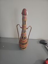 Vtg. Amber Bottle In Plastic colorful Scoubidou wicker 2 Handles 17” Tall picture