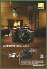 NIKON D40x Camera - Just press the button, darling. - 2008 Nat Geo Print Ad picture