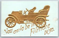 Postcard You Auto be in Filmore Wyoming heavy embossed gold car B79 picture