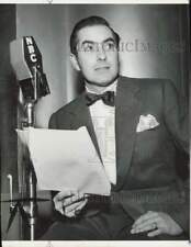 1956 Press Photo Tyrone Power, film star, reads script over NBC. - hpx21149 picture