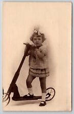 RPPC Little Girl On Scooter Real Photo Studio Postcard A49 picture