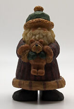 Santa Claus with Green Hat and Holding a Teddy Bear Figurine picture