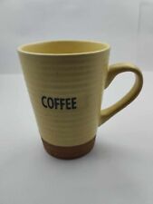 Ceramic yellow and brown coffee cup picture