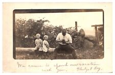 RPPC 1912 Man Holding a Camera with 2 Children Sitting on a Log, Fultonville, NY picture