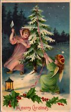 Christmas Postcard Two Angel Girls Chopping Down a Tree with an Axe in the Snow picture