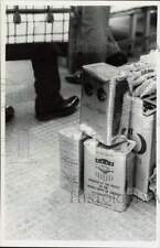 1967 Press Photo Donated cans of oil at Black Market in Vietnam - lra62847 picture