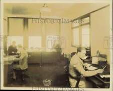 1930 Press Photo Workers at WENR radio station prepare broadcasts in Chicago picture