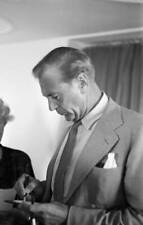 profile shot of Gary COOPER signing an autograph, probably in t 1953 Old Photo picture