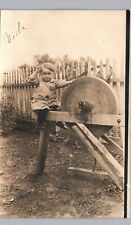 BABY OPERATING GRINDING WHEEL heyworth il real photo postcard rppc illinois work picture