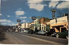 Flagstaff Arizona Main Street Ford Sign Cafe Bakery Postcard c1950 picture