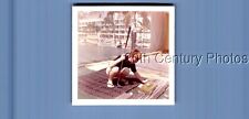 FOUND COLOR PHOTO L_7251 BOY CROUCHING WTIH GOLF CLUB BY BALLS picture