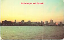 VINTAGE 1960'S POSTCARD -DOWNTOWN CHICAGO SKYLINE AT DUSK LAKE MICHIGAN picture