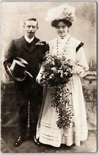 Postcard RPPC 1900s Wedding Couple Portrait Man Woman Dress Flowers Hat    picture