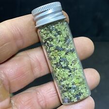 Green Peridot Crystals in a Glass Bottle Jar  picture