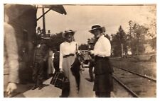 postcard Lady with suitcase at a train station with others RPPC A0320 picture