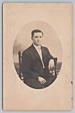 Postcard Vintage RPPC Handsome Young Man Sitting in Chair Studio Photo picture