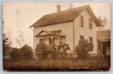 eStampsNet - RPPC Man and Women in Horse and Buggy Calesville WI 1907 Postcard picture