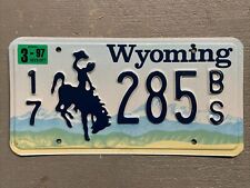 VINTAGE  WYOMING LICENSE PLATE BUCKING BRONCO 17-285BS MAR. 1997 STICKER NICE picture