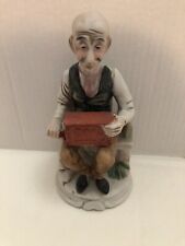 Vintage Porcelain Old Man With His Hurdie Girdie Music Box Sitting on Park Bench picture