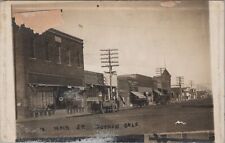 Main Street, Stores, Cars, Dirt Road Guymon Oklahoma 1915 RPPC Photo Postcard picture